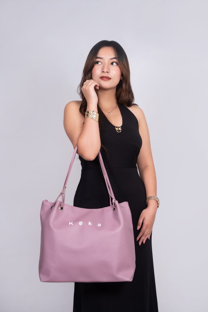 Purple color keka bag in models hand